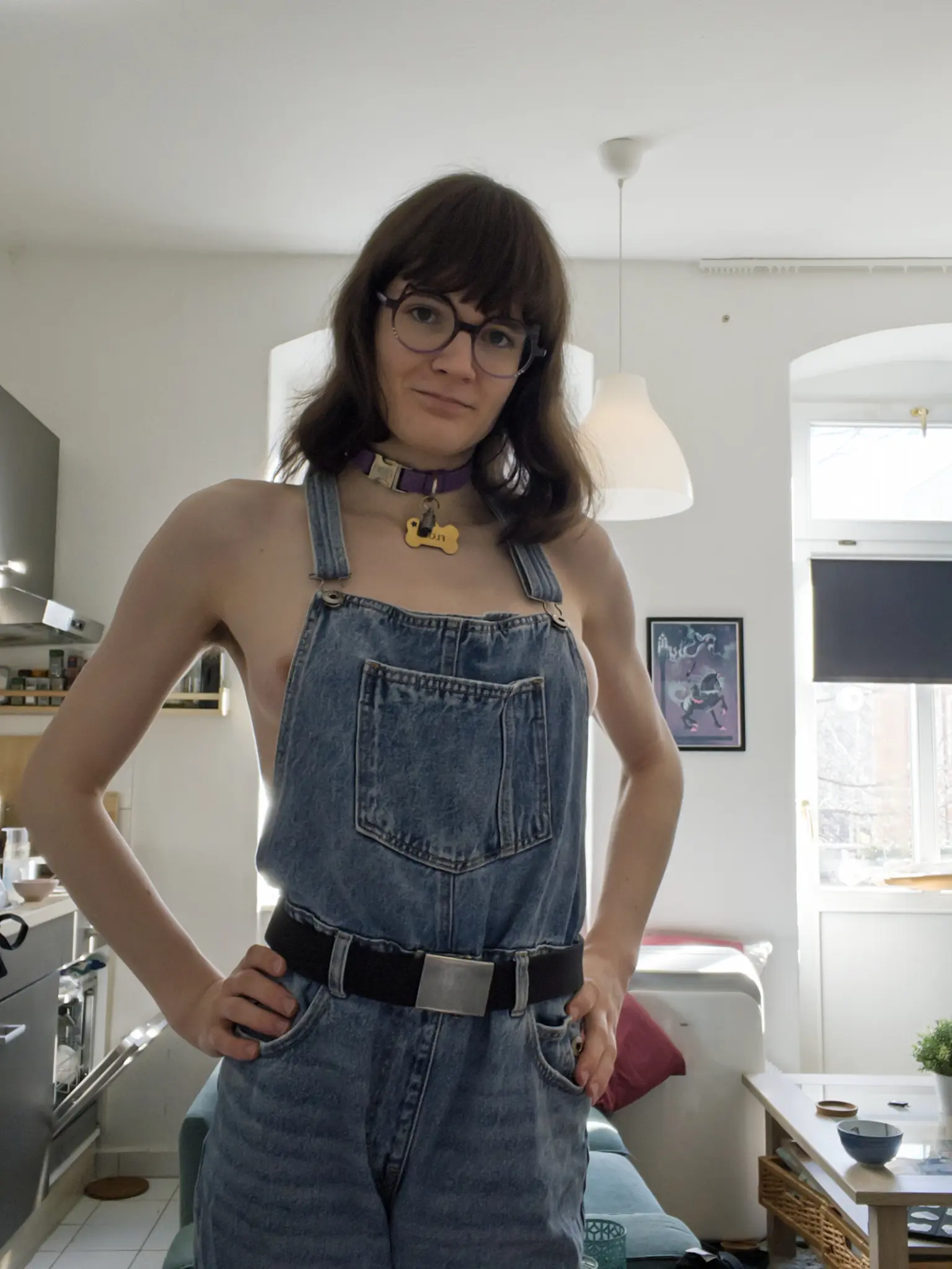 Same as last, but avas left nipple is peeking out her dungarees. They have their hands on their hips