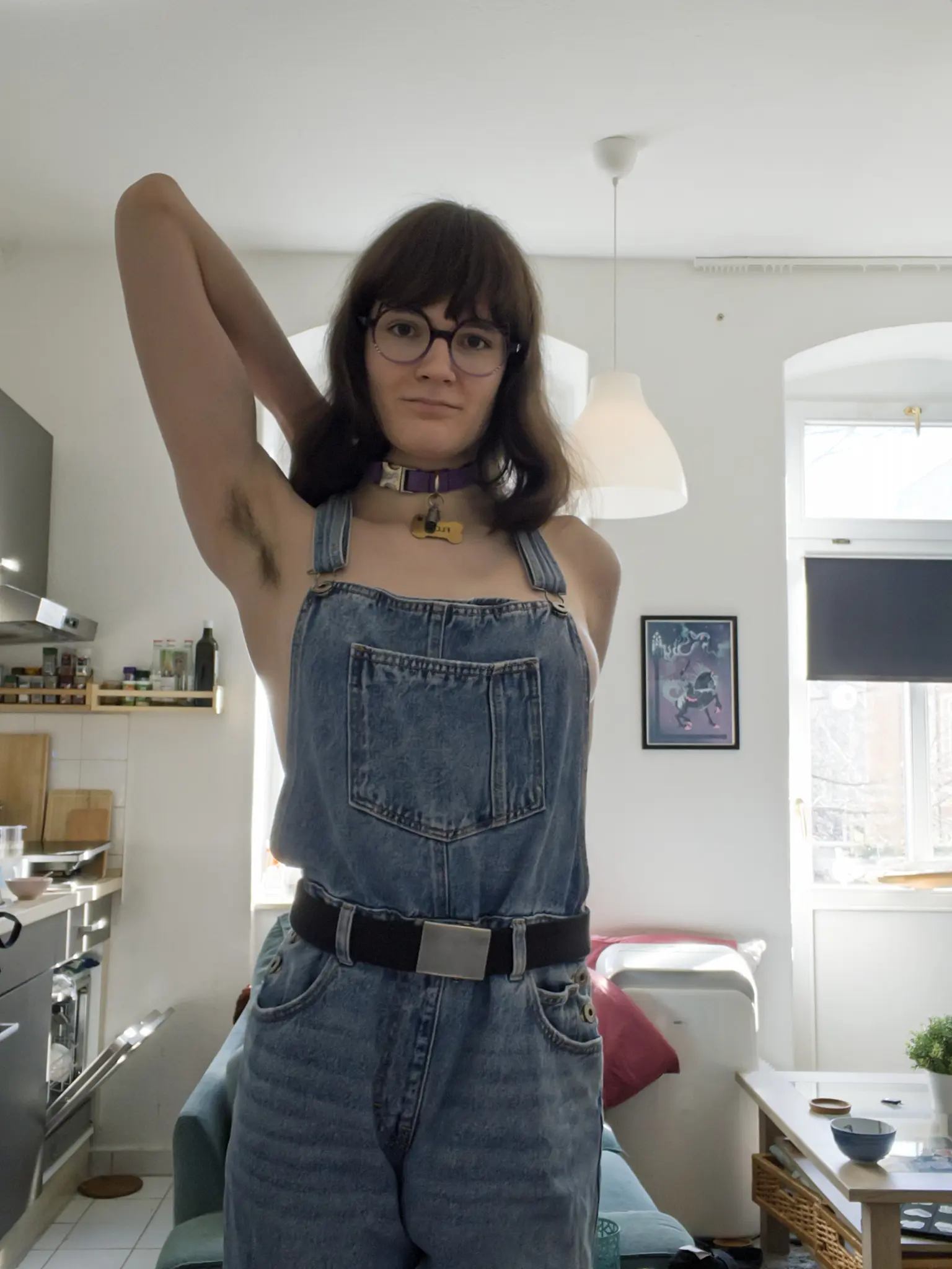 Same as the first picture, but only the left arm is raised. The other arm is behind avas back